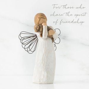 Susan Lordi's Willow Tree "Angel of Friendship" holding a puppy